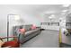 Spacious living room featuring neutral walls, large window and comfortable seating with stylish decor at 12497 W Virginia Ave, Lakewood, CO 80228