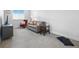 Bright living room with neutral gray color palette, large window and comfortable seating at 12497 W Virginia Ave, Lakewood, CO 80228