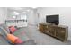 Comfortable living room with neutral walls, stylish decor and carpeted flooring at 12497 W Virginia Ave, Lakewood, CO 80228