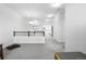 Bright living room with neutral walls, railing and carpeted flooring at 12497 W Virginia Ave, Lakewood, CO 80228