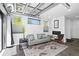 Relax in the stylish living room with a cozy fireplace, comfortable seating, and modern design elements at 12497 W Virginia Ave, Lakewood, CO 80228