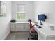 Bright office with natural light, built in storage, modern desk and decor at 12497 W Virginia Ave, Lakewood, CO 80228