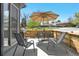 Enjoy outdoor dining on the inviting patio with a barbecue grill, and charming wooden fence at 12497 W Virginia Ave, Lakewood, CO 80228