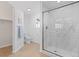 Modern bathroom featuring a glass-enclosed shower, toilet, and stylish fixtures and tile at 306 N 14Th Ave, Brighton, CO 80601