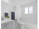 Inviting bathroom with tub-shower, vanity, modern fixtures, and large window for natural light at 306 N 14Th Ave, Brighton, CO 80601