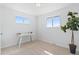 Bright bedroom with desk, natural light, and neutral color scheme, perfect for relaxation and work at 306 N 14Th Ave, Brighton, CO 80601