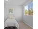 Cozy bedroom with a bed, carpeted floors, neutral paint, and window for natural light at 306 N 14Th Ave, Brighton, CO 80601