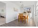 Cozy dining room featuring a wooden table with seating for four and modern light fixture at 306 N 14Th Ave, Brighton, CO 80601