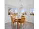 Cozy dining area featuring a wooden table, comfortable seating, and ample natural light streaming through the windows at 306 N 14Th Ave, Brighton, CO 80601