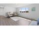 Living room bathed in natural light, showcasing modern flooring and comfortable seating with street view at 306 N 14Th Ave, Brighton, CO 80601