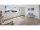 Bright, airy living room featuring modern flooring, comfortable seating, and an inviting view of the neighborhood at 306 N 14Th Ave, Brighton, CO 80601