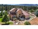 House with a large backyard, deck, and mountain views at 4619 Mohawk Dr, Larkspur, CO 80118