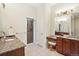 En suite bathroom with double vanity and shower at 4619 Mohawk Dr, Larkspur, CO 80118