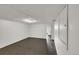 Unfinished basement area with tile floor and white walls at 1202 9Th Ave, Longmont, CO 80501