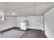 Basement laundry area with white walls, and tile flooring at 1202 9Th Ave, Longmont, CO 80501