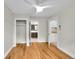 Bedroom featuring wood floors and a view to the kitchen and bathroom at 1202 9Th Ave, Longmont, CO 80501