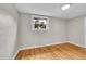 Cozy bedroom with hardwood floors, a window, and neutral paint at 1202 9Th Ave, Longmont, CO 80501