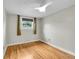 Bright bedroom with hardwood floors, neutral walls, and ceiling fan at 1202 9Th Ave, Longmont, CO 80501