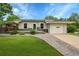 Charming single story home with manicured lawn, rock landscaping, and one-car attached garage at 1202 9Th Ave, Longmont, CO 80501