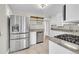 Modern kitchen featuring stainless steel appliances and granite countertops at 1202 9Th Ave, Longmont, CO 80501