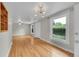 Well-lit living room featuring hardwood floors and large windows at 1202 9Th Ave, Longmont, CO 80501