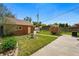 A quaint backyard showcasing a brick building and a well-maintained lawn at 2654 Forest St, Denver, CO 80207
