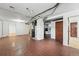 Open basement with utilities, laundry area, and brick-patterned flooring at 2654 Forest St, Denver, CO 80207