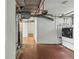 Basement featuring utilities, laundry hookups, and brick-patterned flooring at 2654 Forest St, Denver, CO 80207