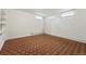 Basement space with white walls, small windows, and geometric carpet at 2654 Forest St, Denver, CO 80207