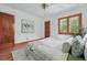 Comfortable bedroom with hardwood floors, natural light, and neutral decor at 2654 Forest St, Denver, CO 80207