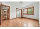 Empty bedroom featuring hardwood floors, closet, and multiple windows at 2654 Forest St, Denver, CO 80207