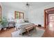 Bright bedroom features hardwood floors, classic ceiling fan, and wooden window frames at 2654 Forest St, Denver, CO 80207