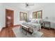 Cozy bedroom with hardwood floors, two windows, and ample natural light at 2654 Forest St, Denver, CO 80207