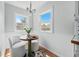 Charming breakfast nook filled with natural light from two windows at 2654 Forest St, Denver, CO 80207