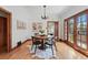 Cozy dining room featuring hardwood floors, a round table, and natural lighting at 2654 Forest St, Denver, CO 80207