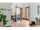 Elegant dining room with hardwood floors, chandelier, and access to the kitchen at 2654 Forest St, Denver, CO 80207