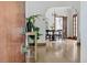 Inviting foyer featuring hardwood floors, arched doorways, and a glimpse into the dining area at 2654 Forest St, Denver, CO 80207