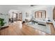 Bright living room with hardwood floors, large windows, and a comfortable seating area at 2654 Forest St, Denver, CO 80207