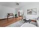 Bright living room featuring hardwood floors, neutral decor, and an open layout at 2654 Forest St, Denver, CO 80207