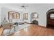 Cozy living room with a decorative fireplace, hardwood floors, and ample natural light at 2654 Forest St, Denver, CO 80207