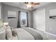 Comfortable bedroom with soft natural light, ceiling fan, and closet at 11844 Oak Hill Way # A, Commerce City, CO 80640