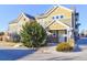 Townhome featuring well-maintained landscaping, private entryway, and modern architectural details at 11844 Oak Hill Way # A, Commerce City, CO 80640