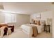 Bedroom with a window, a neutral color scheme, a plush chair and modern side tables at 5555 E 17Th Avenue Pkwy, Denver, CO 80220