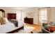 Serene bedroom featuring hardwood floors, light-filled windows, and comfortable seating at 5555 E 17Th Avenue Pkwy, Denver, CO 80220