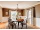 Elegant dining room featuring wainscoting, chandelier, and abundant natural light at 5555 E 17Th Avenue Pkwy, Denver, CO 80220