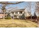 Beautiful two-story house featuring mature landscaping and a well-manicured lawn at 5555 E 17Th Avenue Pkwy, Denver, CO 80220