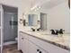 Bright bathroom featuring double sink vanity with granite countertops at 6475 S Dayton St # 102, Englewood, CO 80111