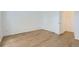 Bedroom featuring wood-look floors and a door leading to another room at 6475 S Dayton St # 102, Englewood, CO 80111