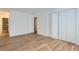 Bedroom with light hardwood floors and large closets at 6475 S Dayton St # 102, Englewood, CO 80111