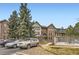 Lovely condo complex with a gated entrance, mature trees, and ample parking for residents and guests at 6475 S Dayton St # 102, Englewood, CO 80111